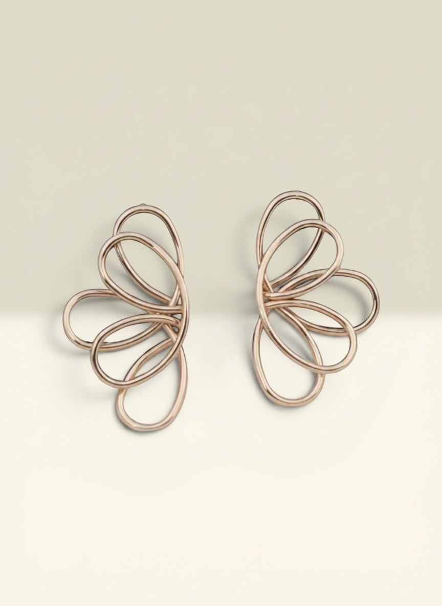 THE GOOD FIND Abstract Wire Frame Earrings in rose gold-tone metal with an open-work floral petal design.