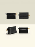 THE GOOD FIND black leather clutch with silver chain strap and metallic clasp. Versatile evening bag.