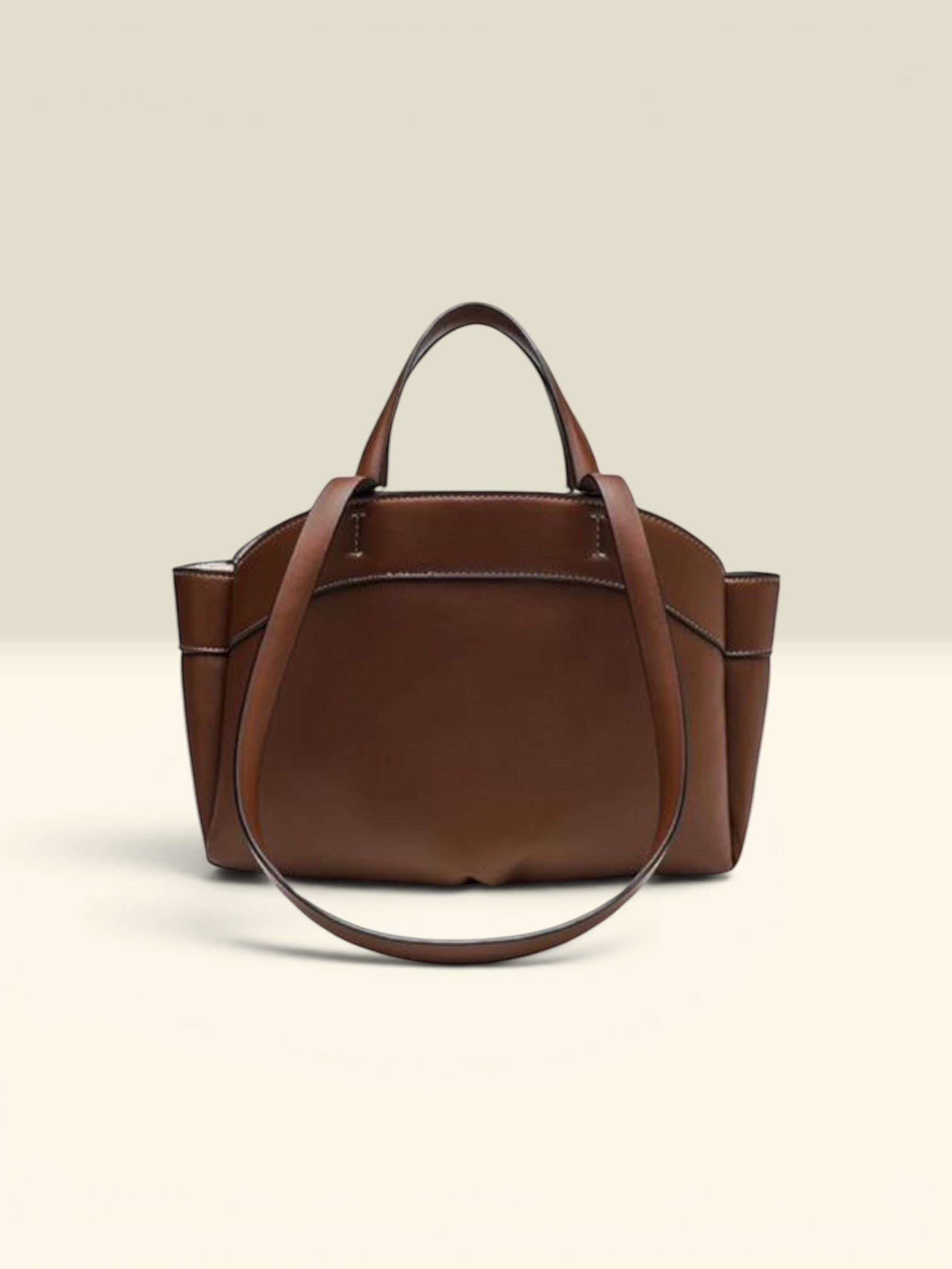THE GOOD FIND brown leather tote bag with matching pouch, top handles, and shoulder strap.