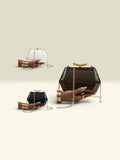 THE GOOD FIND geometric clutch in black, white, and chocolate brown faux croc leather with gold chain.