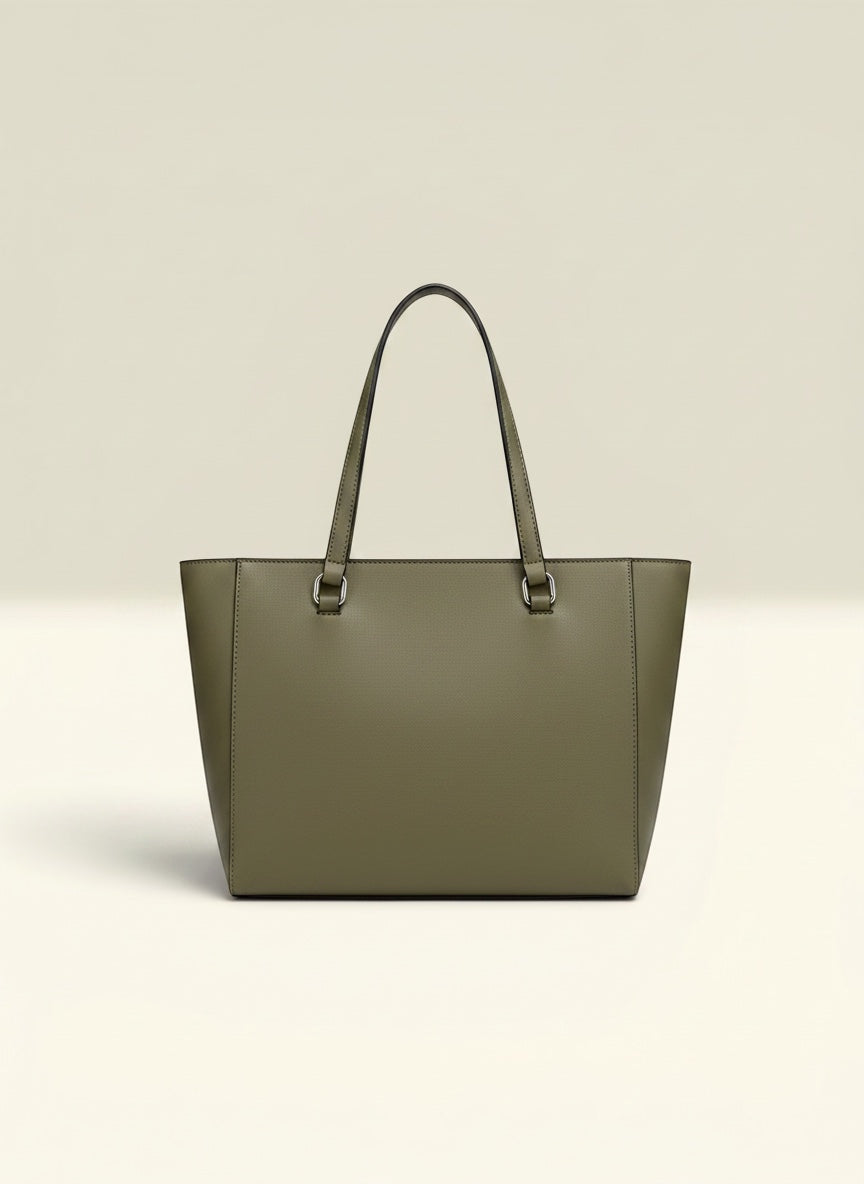 THE GOOD FIND olive green faux leather tote bag with comfortable shoulder straps and subtle logo hardware.
