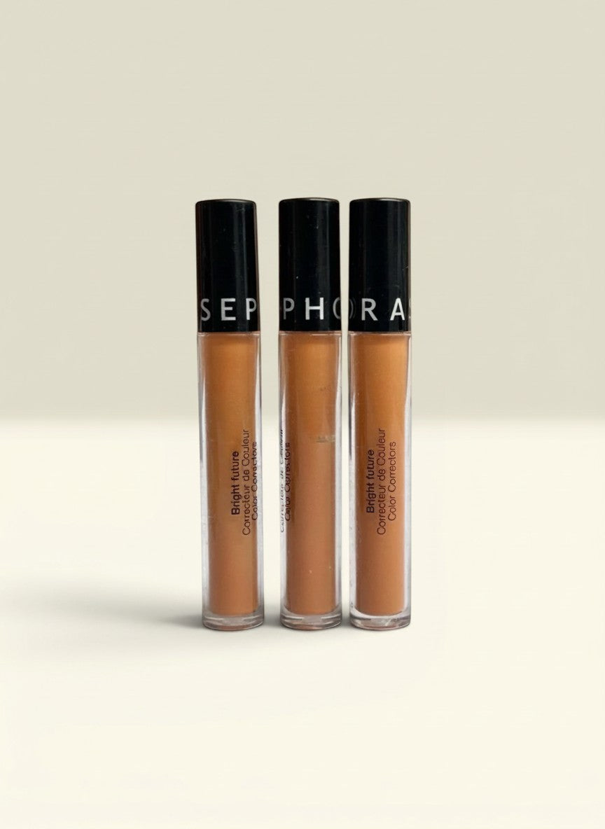 THE GOOD FIND Sephora Bright Future Color Corrector in a warm peachy-orange shade, three tubes lined up.