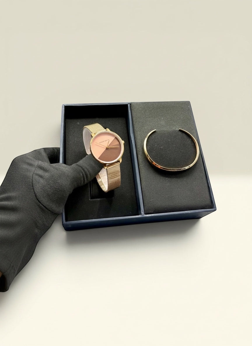 THE GOOD FIND watch and bracelet set with rose gold-tone case, two-tone dial, and gold-tone cuff bracelet.