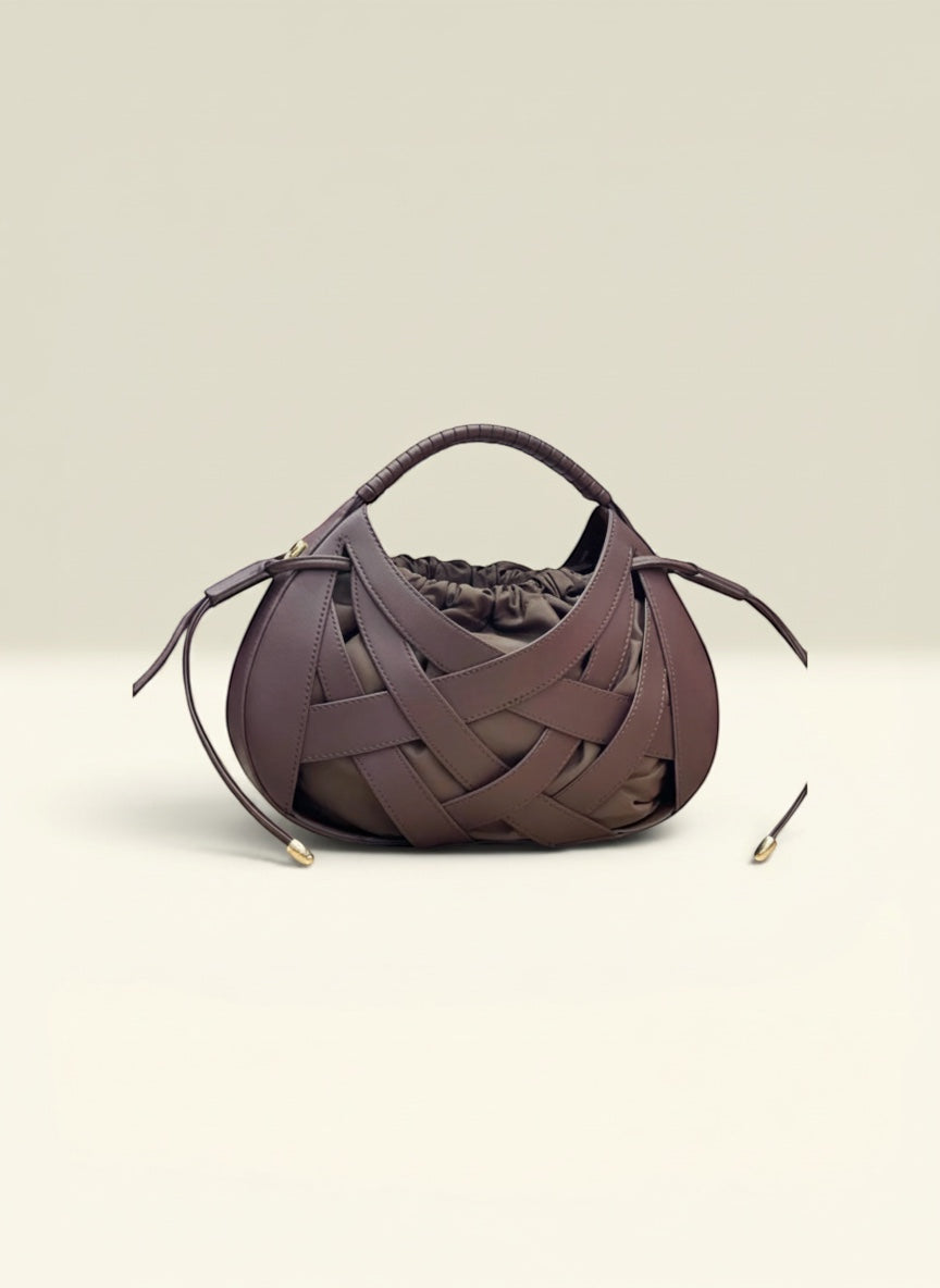 THE GOOD FIND woven leather drawstring handbag in deep brown with gathered interior and braided top handle.